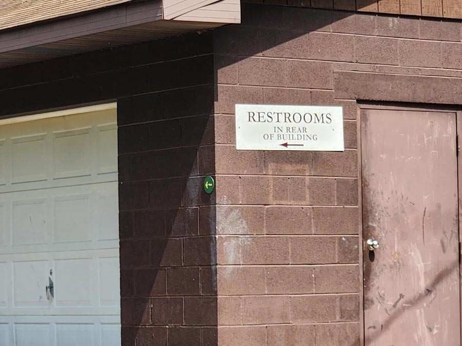 sign to restrooms.