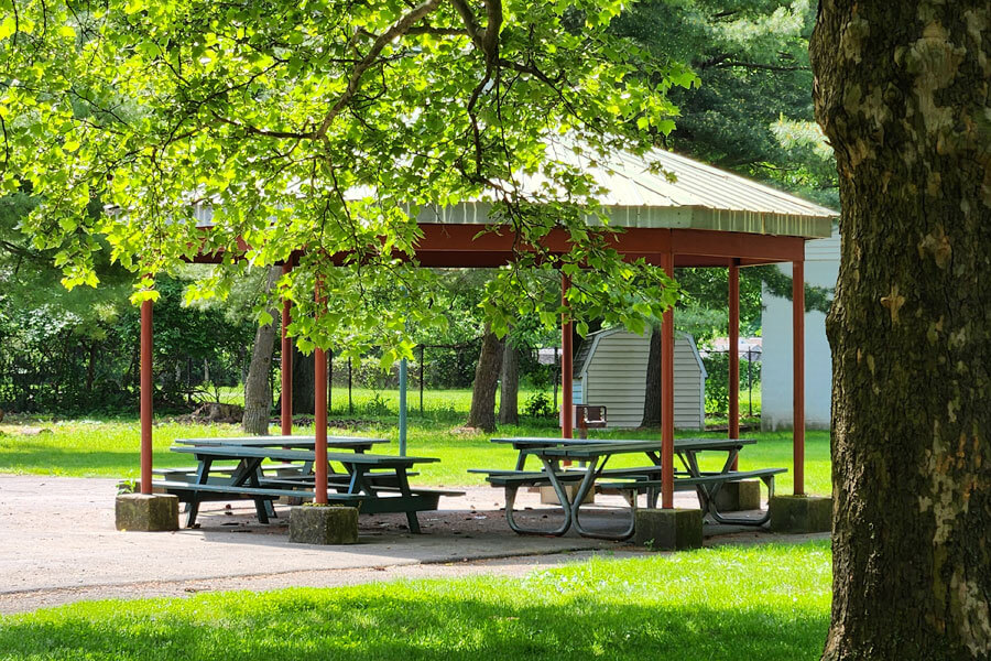small pavilion with picnic tables.