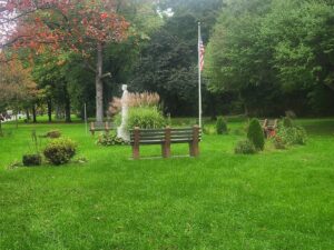 benches and statue and flag.