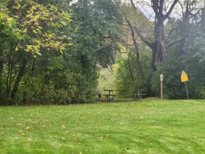 picnic table beside trailhead.