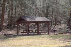 small picnic pavilion with two picnic tables.