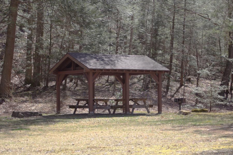 small picnic pavilion with two picnic tables.