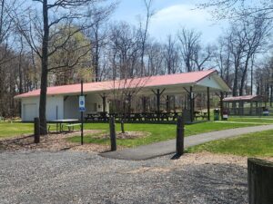 large pavilion with picnic tables and a concession.