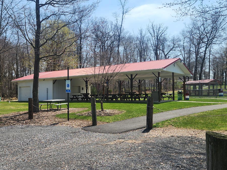 large pavilion with picnic tables and a concession.