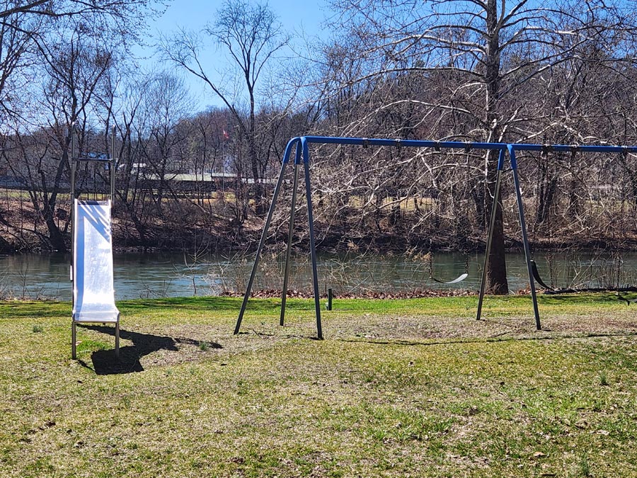 river, slide, and swings.