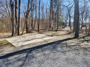handicap parking spot and picnic table and grill.
