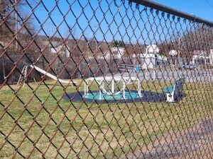 merry-go-round, slide, and a basketball court.