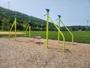 swing suspended between poles.