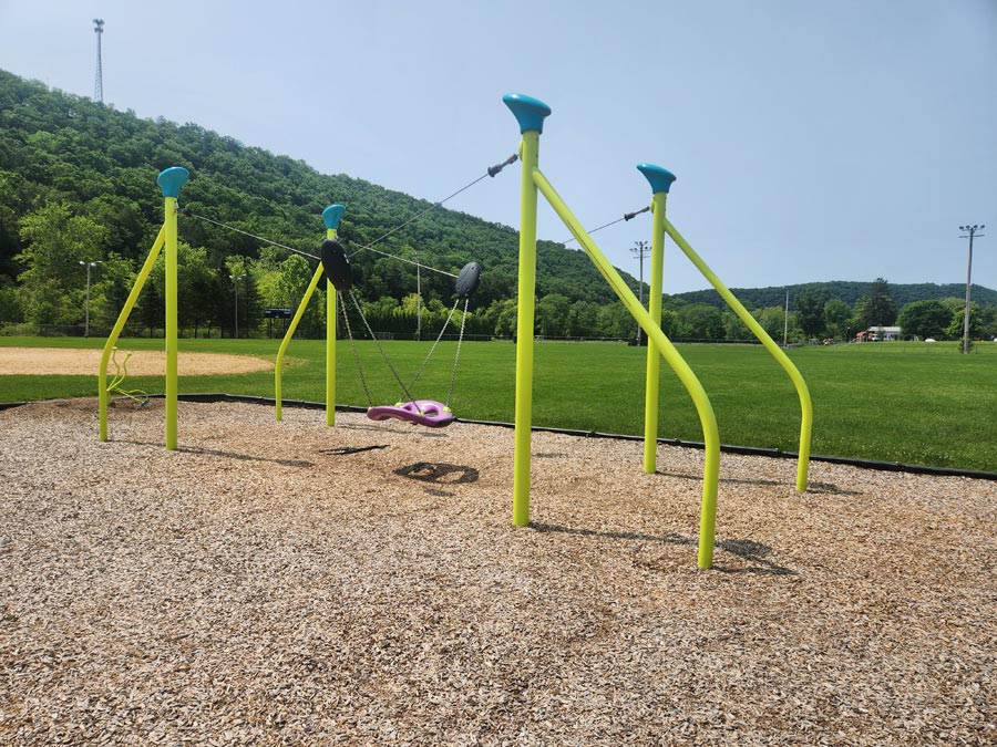 swing suspended between poles.