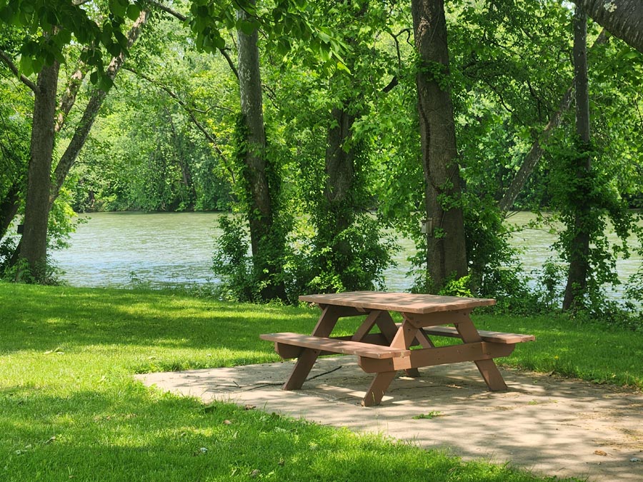 picnic table by river.